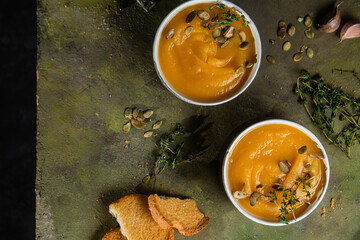 Obraz na płótnie Canvas Pumpkin puree soup. Vegetable soup in a bowl