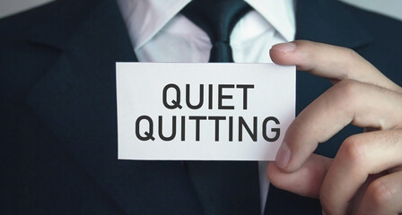 Human showing Quiet Quitting message. Business concept