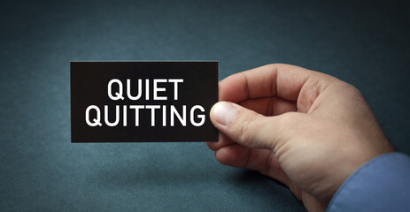 Human showing Quiet Quitting message. Business concept