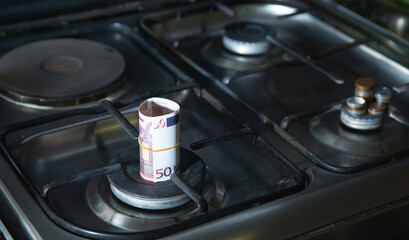 Euro money on gas stove. Gas price