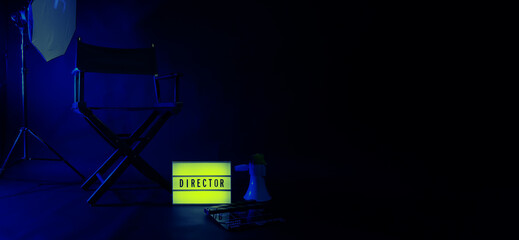 Director chair with cinema lightbox sign Director text on it and clapperboard megaphone and black background studio. Director seat on video production or filming set used in film industry. Real no 3D