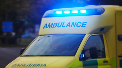Ambulance car of emergency medical service in blurred motion. Themes rescue, urgency and health...