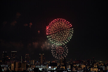 View of fireworks during a summer festival with a clear sky night (Toyonaka, Osaka, Japan) (20221203-001)