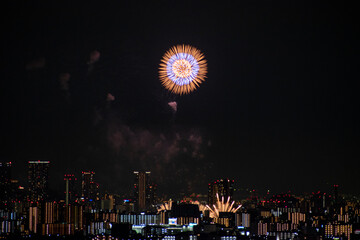 View of fireworks during a summer festival with a clear sky night (Toyonaka, Osaka, Japan) (20221203-002)