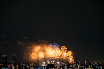 View of fireworks during a summer festival with a clear sky night (Toyonaka, Osaka, Japan) (20221203-007)