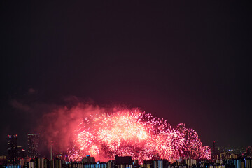 View of fireworks during a summer festival with a clear sky night (Toyonaka, Osaka, Japan) (20221203-009)