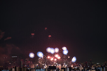 View of fireworks during a summer festival with a clear sky night (Toyonaka, Osaka, Japan) (20221203-010)