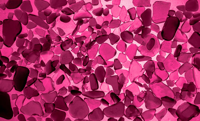 Sea glass background in Viva Magenta. Red leaf top view. Color of the year 2023