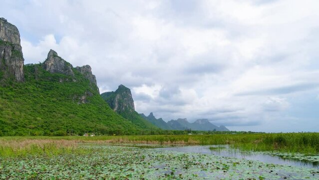 Lake with lotus at Sam Roi Yod National Park, Prachuap Khiri Khan, Thailand; zoom out - Time Lapse