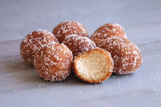 Cape Malay bollas. Deep fried donuts sprinkled with dessicated coconut. Also known as drop donuts 