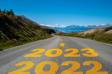 2023 New Year road trip travel and future vision concept . Nature landscape with highway road...