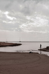 Pescador en la playa