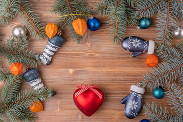 Christmas background with a Christmas tree and decoration on a dark wooden board