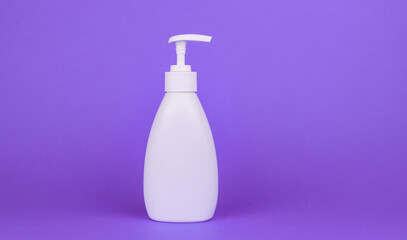 White bottle with a dispenser on a purple background