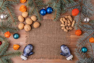 Christmas background with a Christmas tree and decoration on a dark wooden board