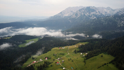 Aerial drone view of Zabljak in National Park Durmitor in Montenegro. Unesco protected area. Holidays and vacations in nature. Magical and foggy landscape. 
