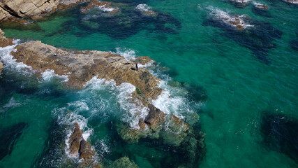 Aerial drone view of Beach in Algarve, Portugal during summer holidays. Amazing destinations.  Travel and adventure. Vacations on the seaside.  Exotic traveling. Most visited places. 