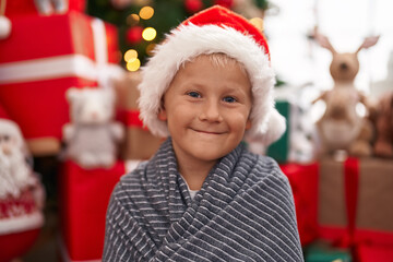 Adorable toddler smiling confident standing by christmas tree at home