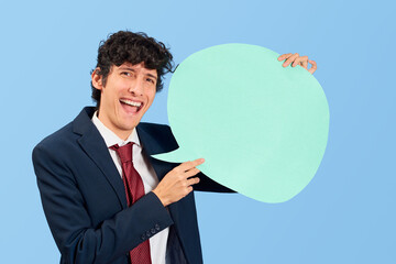 Businessman with dialogue bubble in blank on blue flat lay.