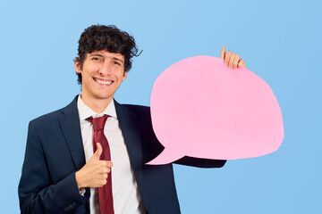 Businessman with dialogue bubble or dialogue balloon in blue flat lay.
