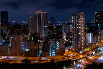 Fototapeta na wymiar Skyscrapers and highways through Minato, Tokyo, Japan