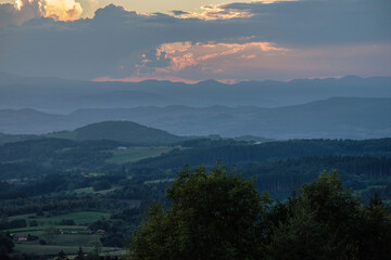 sunset over the typical vulcans mountains of the french Auvergne in summer
