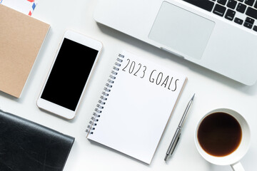 Notebook with 2023 goals text on it to apply new year resolutions and plan.