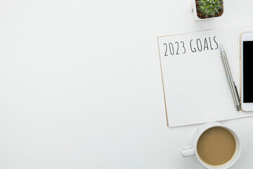 Notebook with 2023 goals text on it to apply new year resolutions and plan.