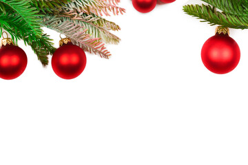 A sprig of spruce decorated with red сhristmas ball isolated on white.