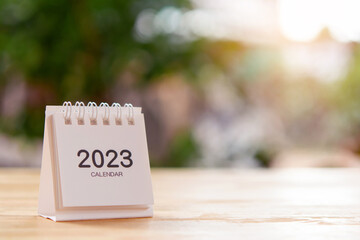 2023 Desk calendar on wooden table. Copy space
