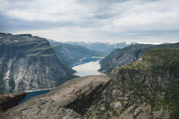 Trolltunga, view on troll tongue reef over the lake. Beautiful nature. Tourist popular place. Ringedalsvatnet, Odda, Norway. 