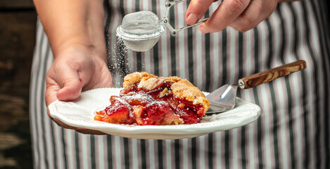 Plum Galette. Woman hands holds plum cake or pie. banner, menu, recipe place for text
