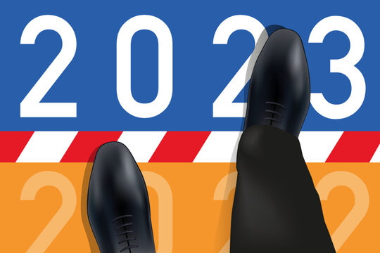 Carte de vœux 2023 montrant les pieds d’un homme vue du dessus qui franchissent une ligne symbolisant le passage à la nouvelle année.