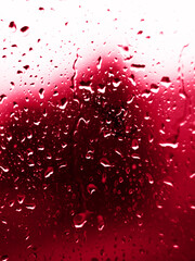 raindrops on glass in color 2023 viva magenta. High quality photo