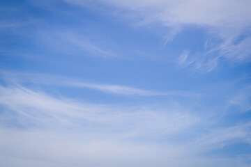 Blue sky with soft white clouds for background