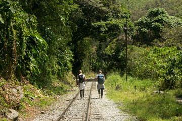 Hiking from Santa Teresa Hidroeléctrica to Aguas Calientes to reach Machupichu. Path following the...