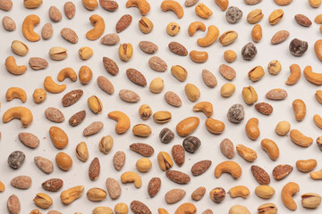  A group of almonds, pistachios, walnuts, macadamia, cashews.