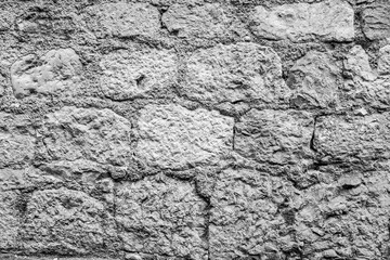 Stone wall for backdrop design, close-up. Natural texture from big stones for publication, poster, calendar, post, screensaver, wallpaper, postcard, banner, website. High quality photo
