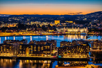 Oslo city center and waterfront golden dusk view from above