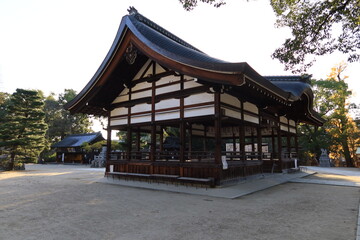 Naklejka premium A Japanese shrine in Kyoto : a scene of Hai-den Prayer Hall in the precincts of Fuji-no-mori-jinjya Shrine 京都にある日本の神社：藤森神社境内にある拝殿の風景