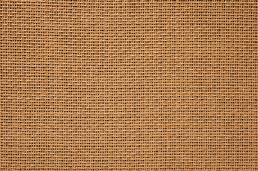 The texture of the fabric on the front panel of the combo amplifier for acoustic and electric guitars with a vintage look.