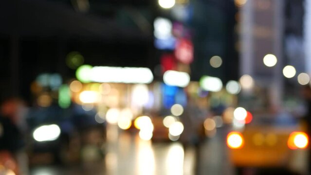 Defocused pedestrians walking on zebra in twilight, people crossing road on crosswalk, crowd on megapolis street in evening dusk. Big city life, urban downtown. Moscow looks like New York. Ped xing.