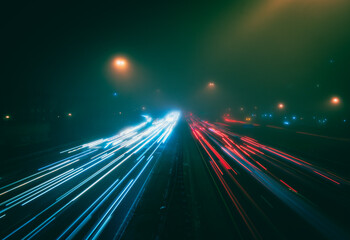 Highway traffic during a foggy night