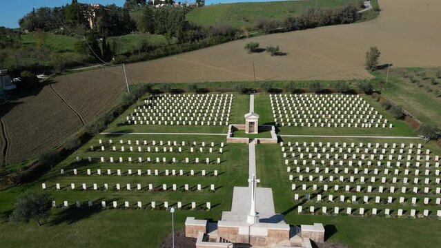 4k 24 fps aerial view of an English war cemetery in Montecchio Pesaro Urbino Marche region of Italy