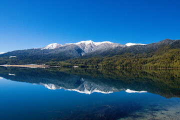 Fototapeta na wymiar Beautiful Lake with Snowy Mountains Himalaya Rara Lake National Park Mugu Karnali Nepal Green Blue