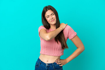 Young Brazilian woman isolated on blue background suffering from pain in shoulder for having made an effort