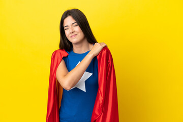 Super Hero Brazilian woman isolated on yellow background suffering from pain in shoulder for having made an effort © luismolinero