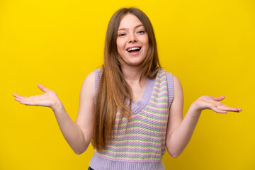 Young caucasian woman isolated on yellow background with shocked facial expression