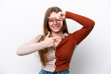 Young caucasian woman isolated on white background focusing face. Framing symbol