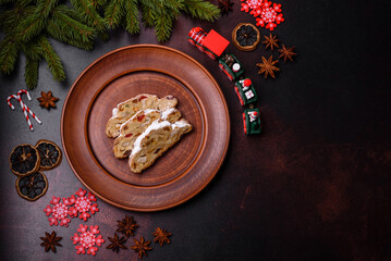 Fototapeta na wymiar Tasty christmas stollen with marzipans, dried fruits and nuts
